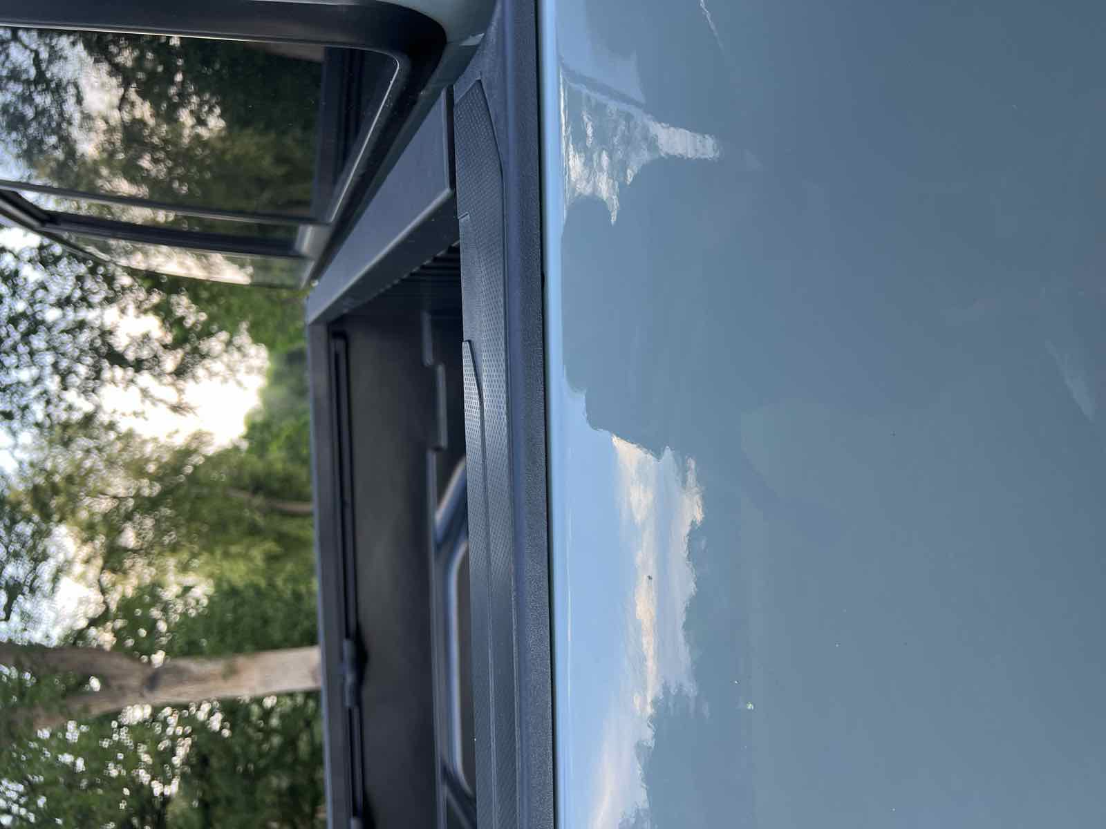 The finished, sealed Tacoma bed rail with the plastic cap reinstalled cleanly, ready for a Tune M1 camper to mount.